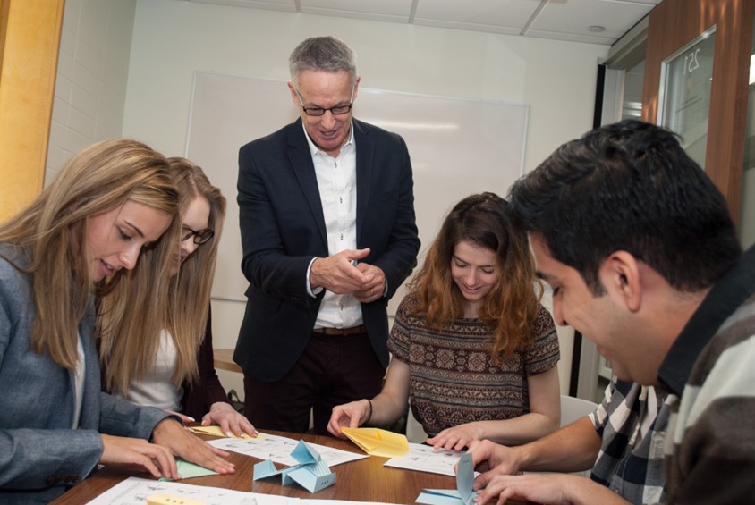 Dr. Sheehan with USask students who are working on a project together