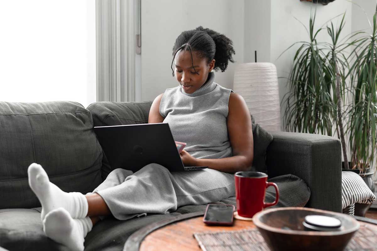 An image of a student studying online using a laptop